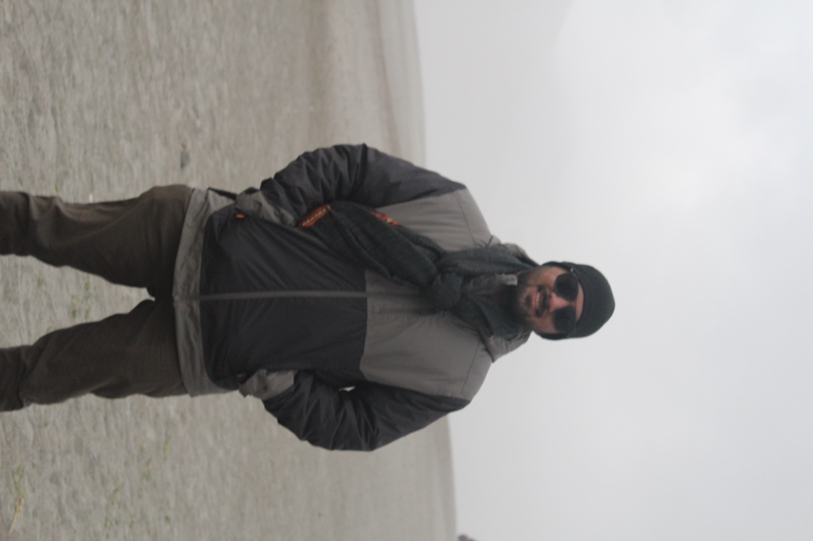 Sharath wearing a jacket and shawl in the Nubra Desert